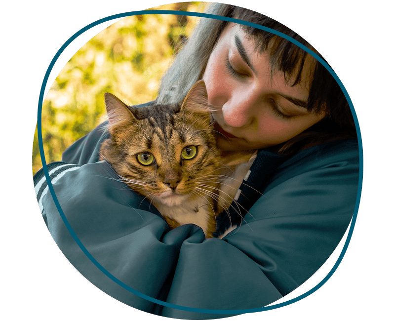 girl hugging furry cat